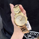 Guess Cubed Analog Gold Dial Gold Steel Strap Watch For Women - GW0606L2